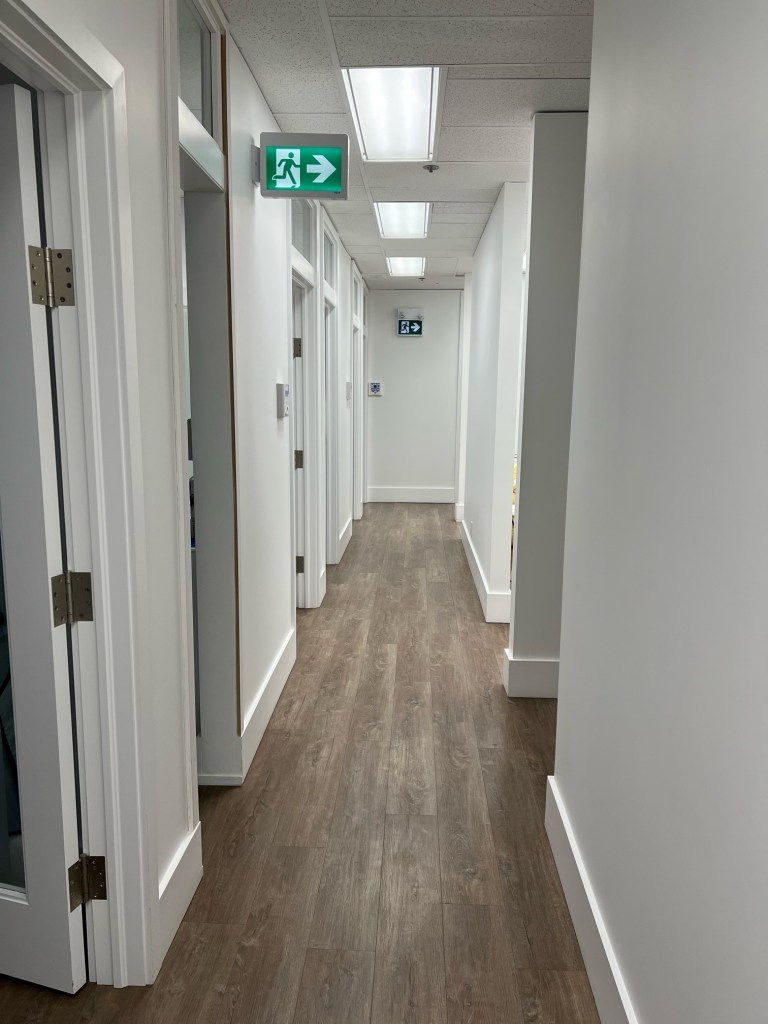 The hallway spanning the length of the office.