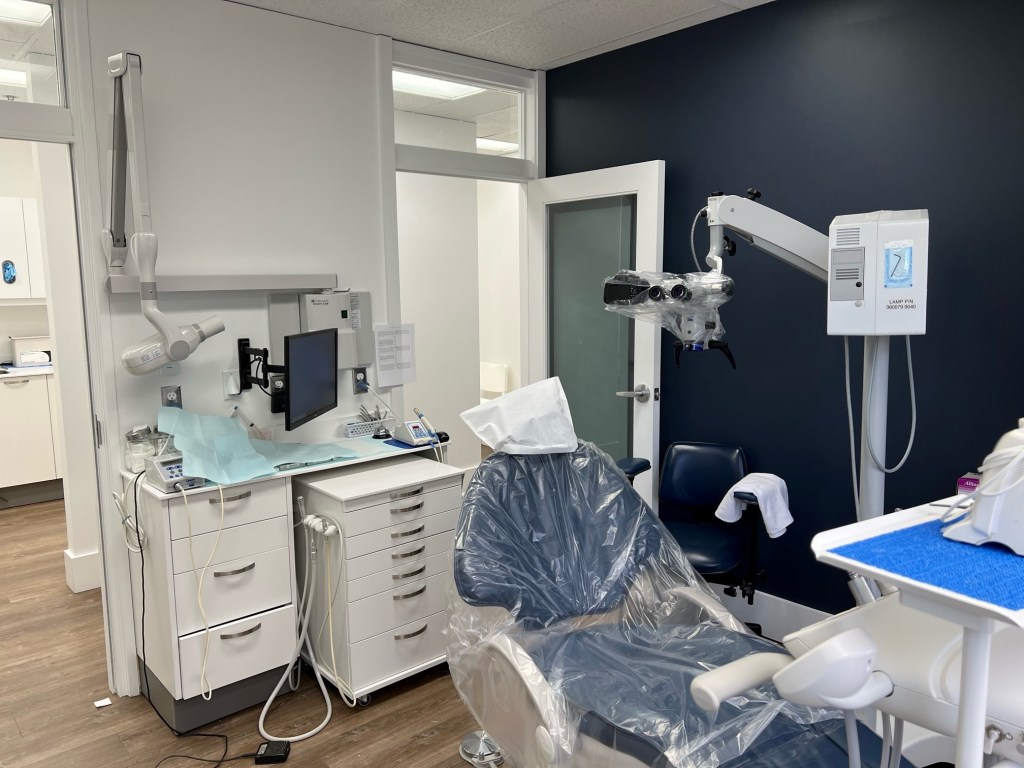 A dental chair wrapped in plastic.